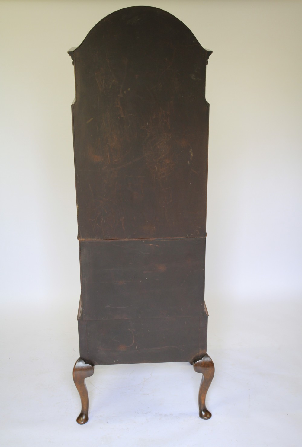 A tall Queen Anne Revival walnut bureau bookcase with an arched glazed upper door, slant-front writing slope, two drawers, and cabriole legs. View VI