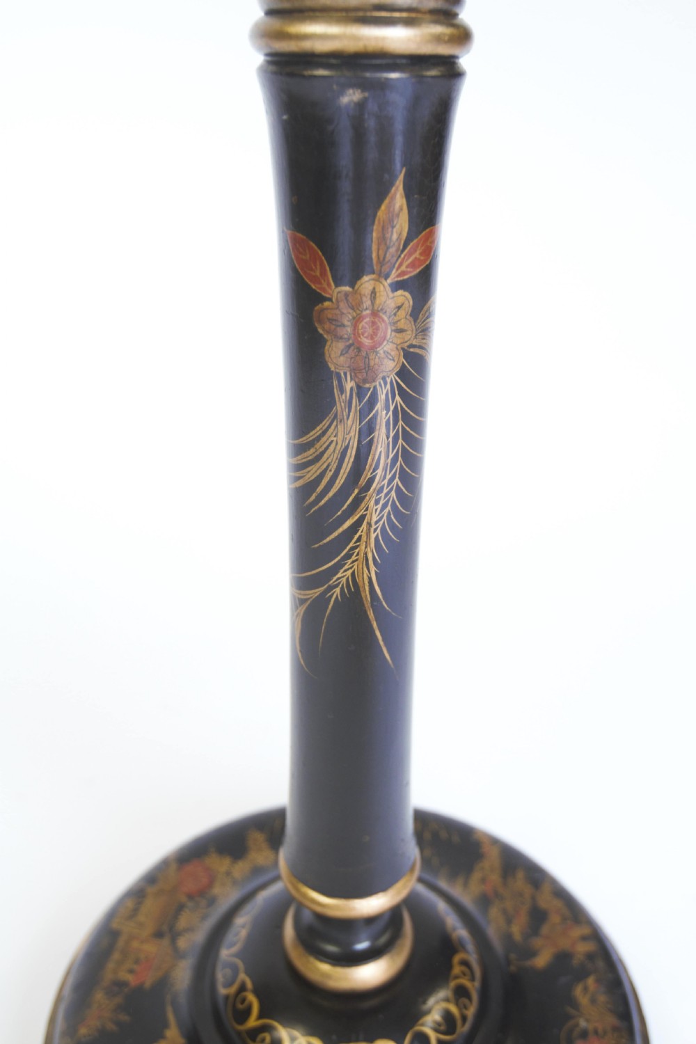 A tall black lacquered turned wooden standard lamp decorated with hand-painted gold floral Chinoiserie designs resting on a circular base. View VI