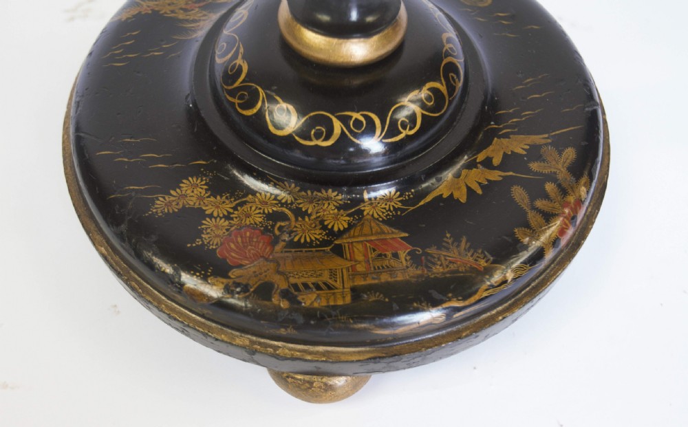 A tall black lacquered turned wooden standard lamp decorated with hand-painted gold floral Chinoiserie designs resting on a circular base. View VIII
