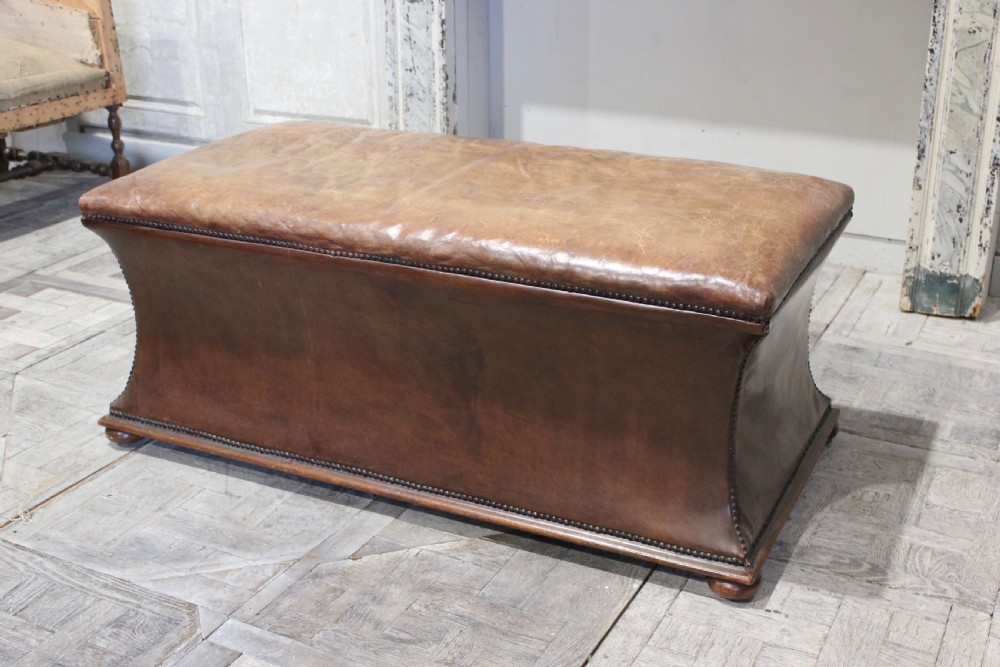 Leather covered ottoman