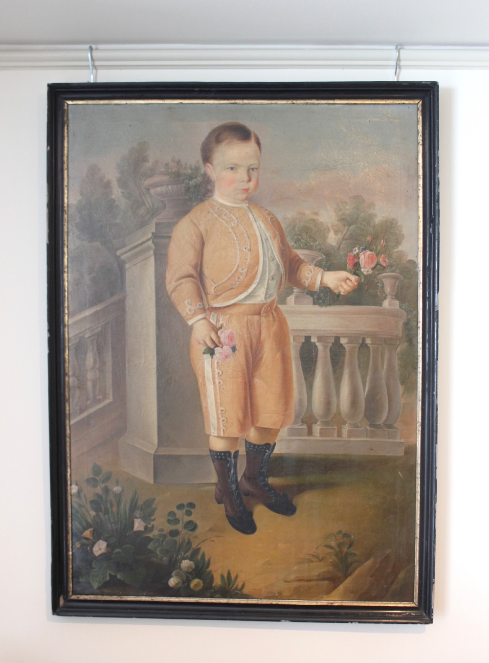 Early 19th century painting of a Nobel boy holding flowers
