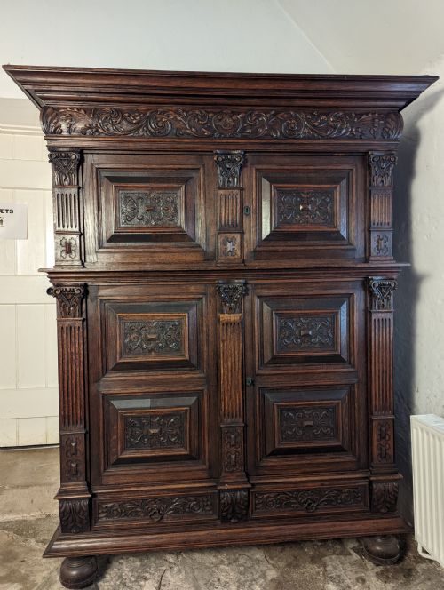 A Continental Carved Oak Cupboard