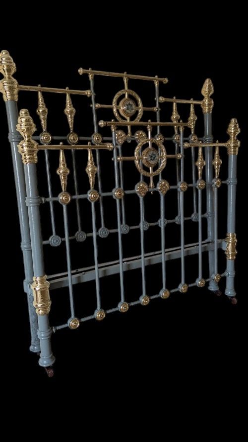 A Victorian 4'6" Double Brass and Iron Bed.