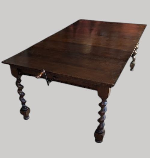 An Oak Extending Dining Table on Barley Twist Legs