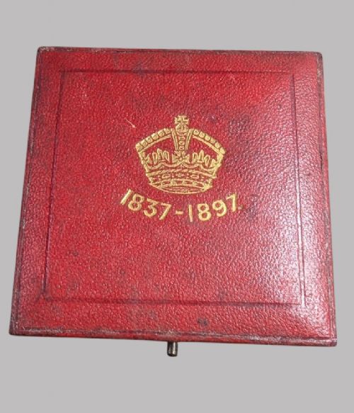 An official Victorian bronze commemorative medallion featuring a raised profile portrait of Queen Victoria, displayed inside its original fitted red presentation case lined with velvet. View III