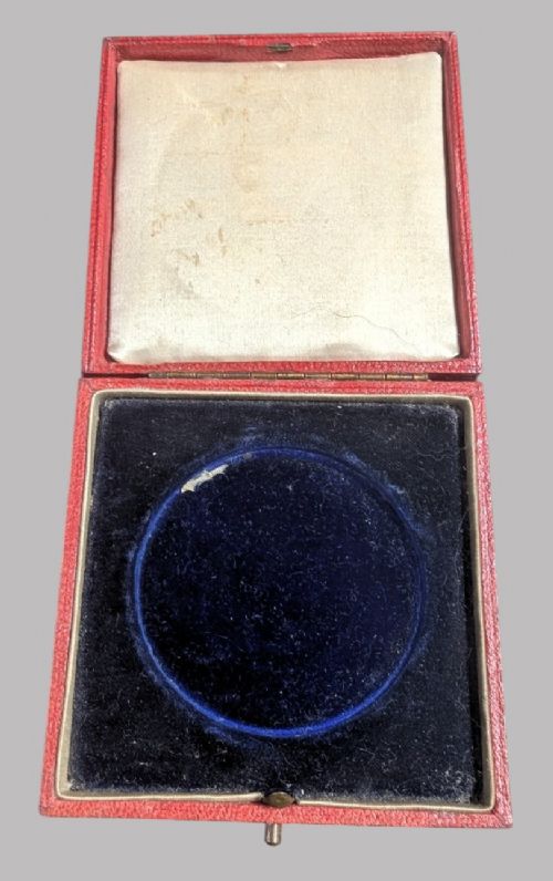 An official Victorian bronze commemorative medallion featuring a raised profile portrait of Queen Victoria, displayed inside its original fitted red presentation case lined with velvet. View IV