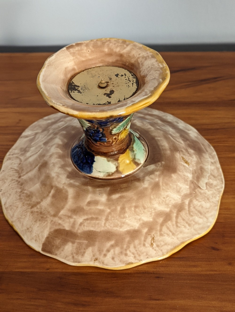 A Victorian majolica pedestal dish featuring moulded green leaves, blue berries, and yellow accents over a brown glazed earthenware surface. View IV