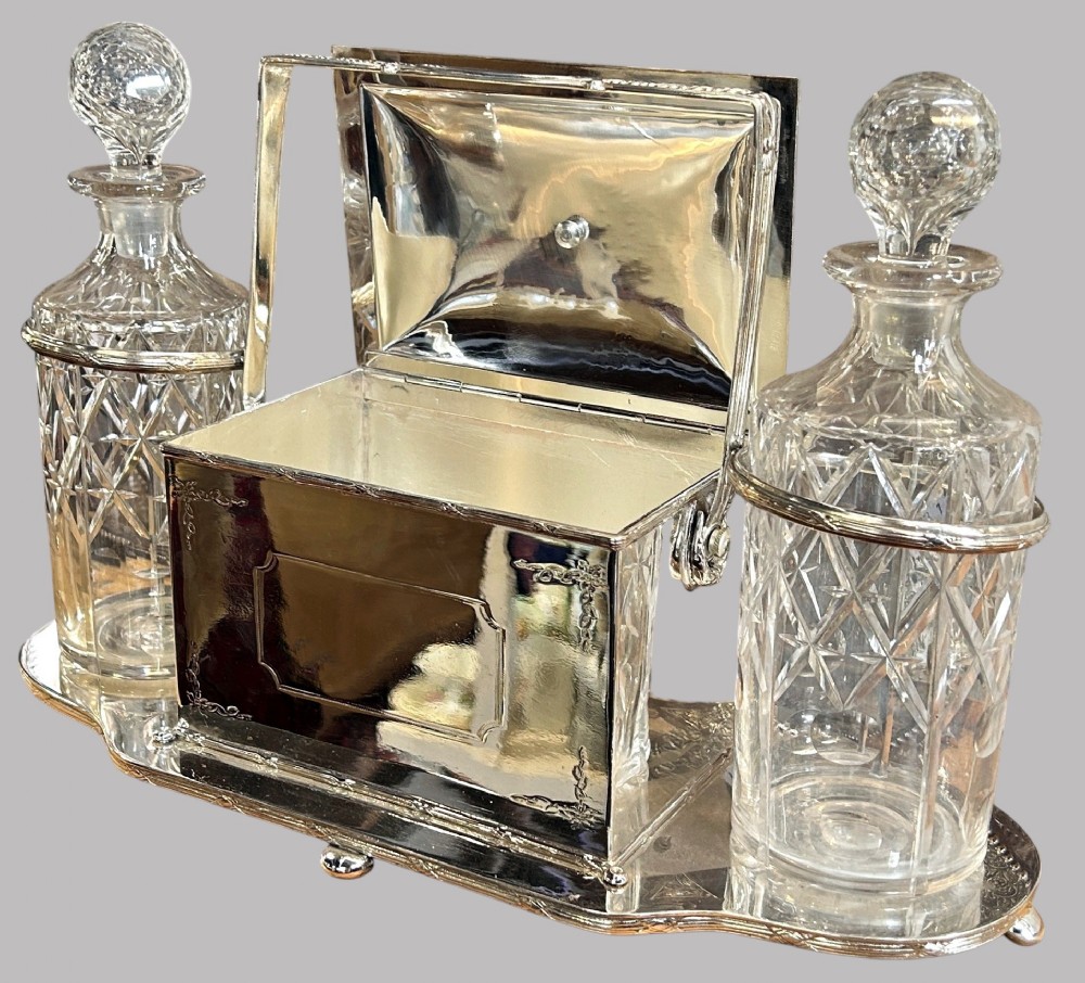 An Unusual Edwardian Silver Plated Decanter Holder and Biscuit Box