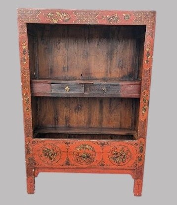 A 19th-century red lacquered Chinese open cabinet featuring hand-painted floral motifs on the outer frame and a central shelf with two small drawers.