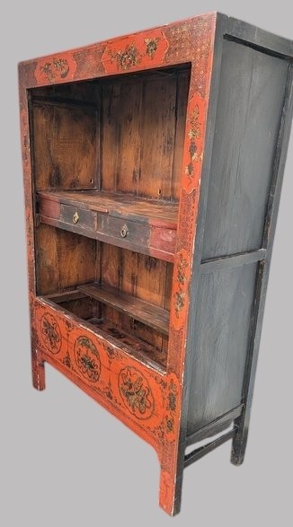 A 19th-century red lacquered Chinese open cabinet featuring hand-painted floral motifs on the outer frame and a central shelf with two small drawers. View IV
