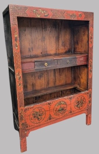 A 19th-century red lacquered Chinese open cabinet featuring hand-painted floral motifs on the outer frame and a central shelf with two small drawers. View X