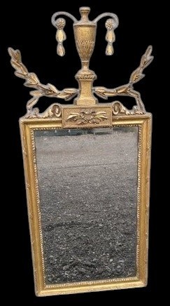 A late 19th-century rectangular Neoclassical giltwood wall mirror featuring an urn cresting and laurel branch swags.