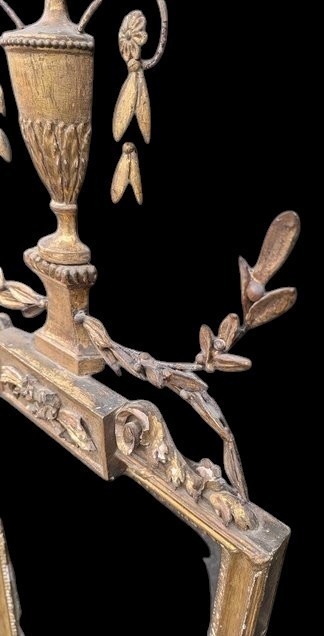 A late 19th-century rectangular Neoclassical giltwood wall mirror featuring an urn cresting and laurel branch swags. View III