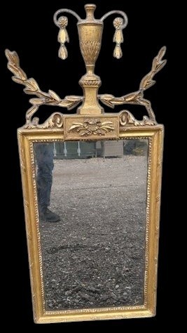 A late 19th-century rectangular Neoclassical giltwood wall mirror featuring an urn cresting and laurel branch swags. View VI