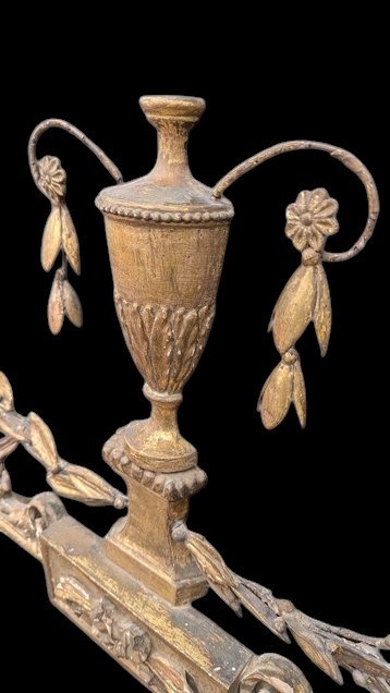 A late 19th-century rectangular Neoclassical giltwood wall mirror featuring an urn cresting and laurel branch swags. View VII