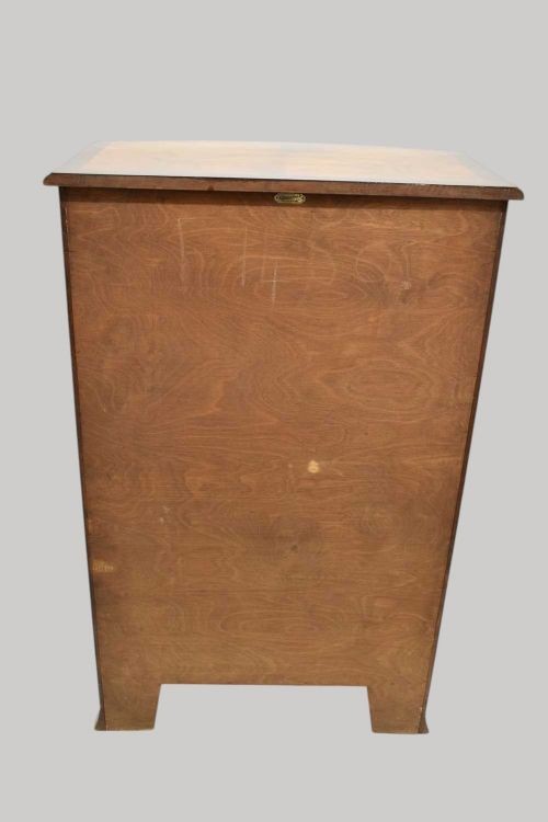 A tall Georgian style bowfront chest of drawers crafted in figured burr walnut with brass drop handles. View IV