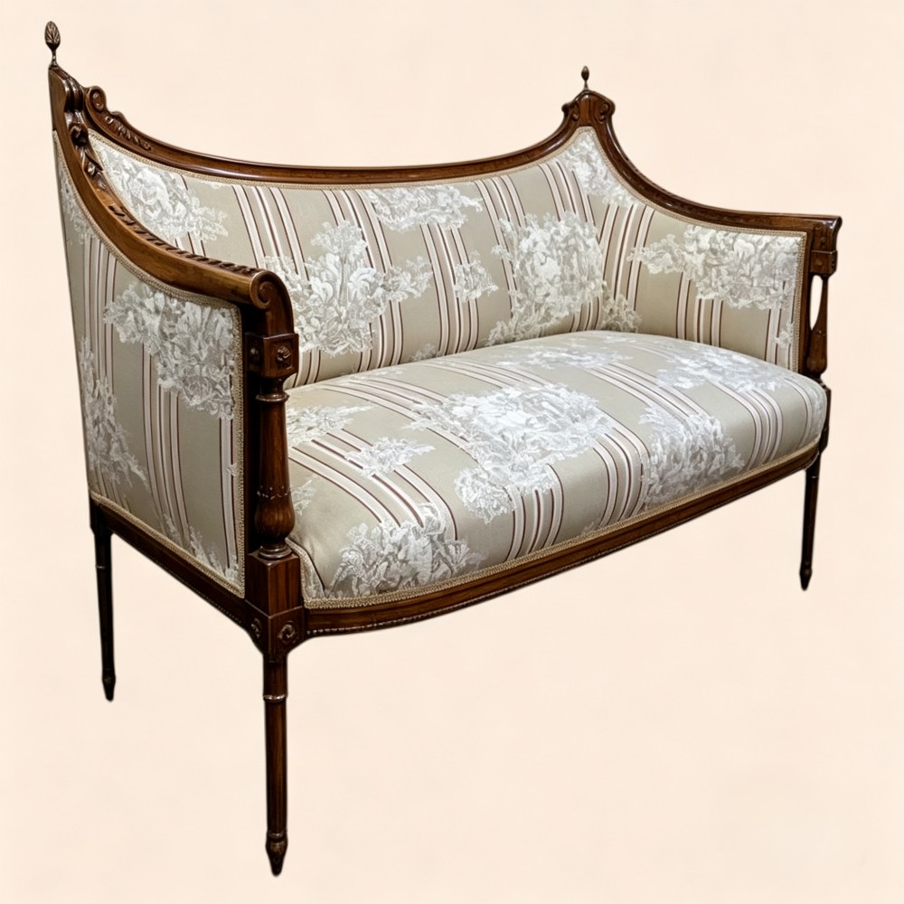 An Edwardian walnut drawing room sofa with a curved backrest, turned finials, slender turned legs, and beige striped floral upholstery. View II