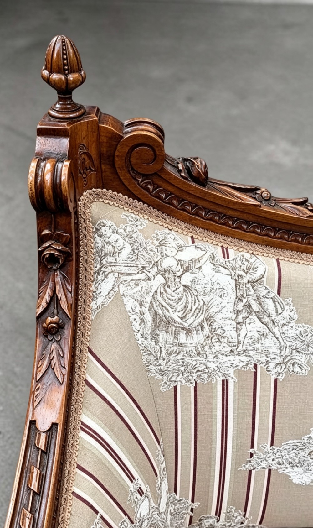 An Edwardian walnut drawing room sofa with a curved backrest, turned finials, slender turned legs, and beige striped floral upholstery. View IV