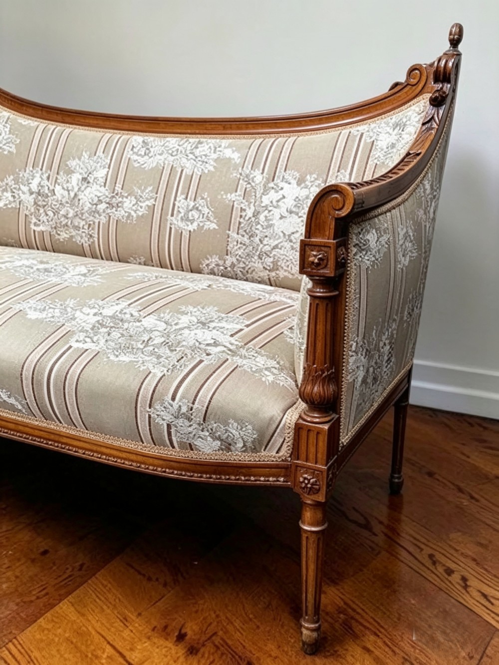 An Edwardian walnut drawing room sofa with a curved backrest, turned finials, slender turned legs, and beige striped floral upholstery. View VIII