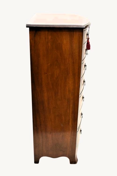 A tall Georgian style bowfront chest of drawers crafted in figured burr walnut with brass drop handles. View VII