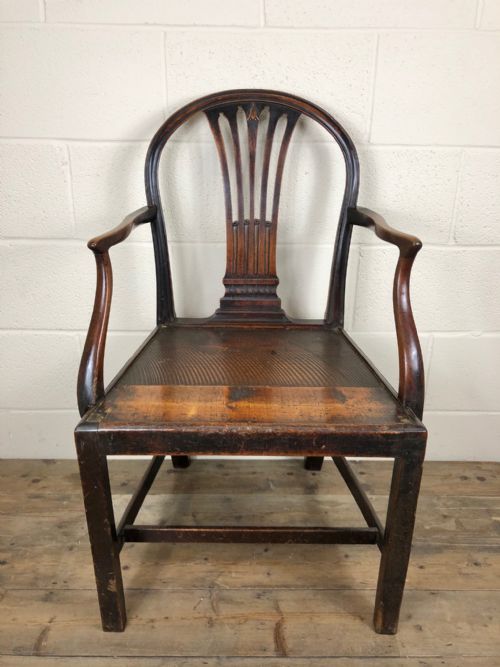 fig 1. 19th Century Armchair with Decorative Back