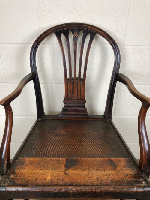 fig 2. 19th Century Armchair with Decorative Back