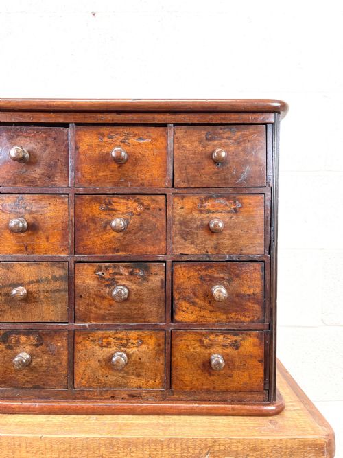 fig 1. Antique Wooden Bank of Drawers