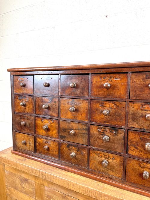 fig 2. Antique Wooden Bank of Drawers