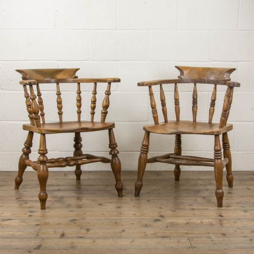 Two Similar Antique Elm Captain’s Chairs