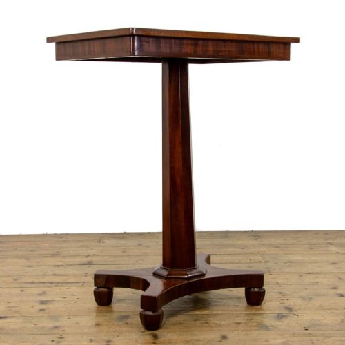 fig 1. A dark brown mahogany side table featuring a rectangular top with geometric timber inlay, a central octagonal column, and a four-pointed pedestal base.