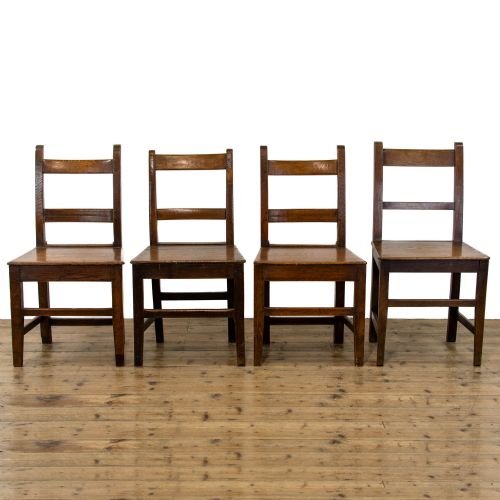 Harlequin Set of Four Antique Oak Farmhouse Chairs