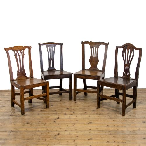 Harlequin Set of Four Antique Oak Farmhouse Chairs