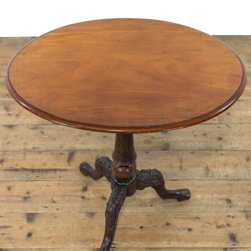 fig 1. A Victorian mahogany tripod wine table featuring a round top, a spiral-turned central pedestal, and three carved legs.