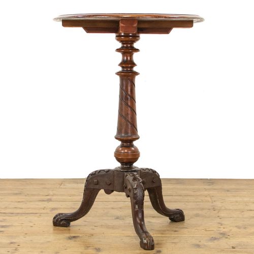 fig 2. A Victorian mahogany tripod wine table featuring a round top, a spiral-turned central pedestal, and three carved legs.