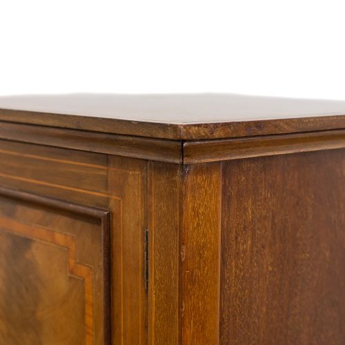 fig 1. An Edwardian mahogany pot cupboard with boxwood inlay, flanked by two matching inlaid side chairs with mustard yellow upholstered seats.