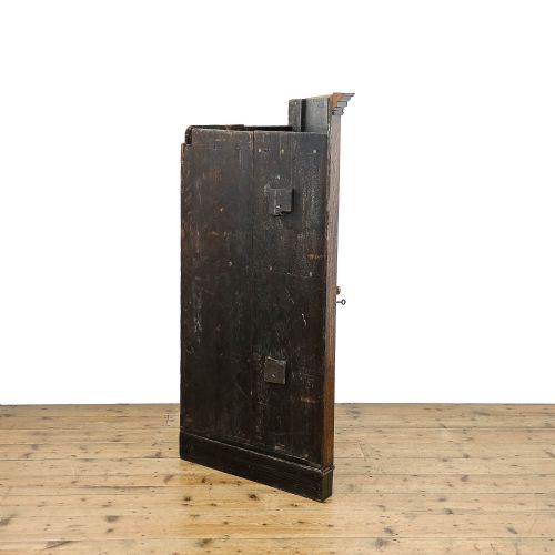fig 3. An antique Georgian dark oak wall-hanging corner cupboard featuring a moulded top cornice, a single fielded panel door with a central inlaid diamond motif, and a brass keyhole.