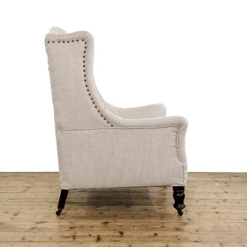 fig 2. Antique Upholstered Cream Wing Back Armchair