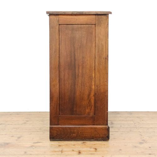 fig 1. An antique mahogany chest featuring two short drawers above three full-width drawers, styled with decorative brass drop handles and a bracket foot plinth base.