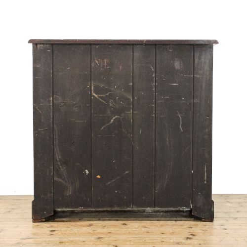 fig 2. An antique mahogany chest featuring two short drawers above three full-width drawers, styled with decorative brass drop handles and a bracket foot plinth base.