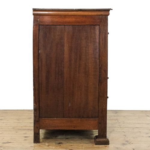 fig 1. An 18th-century walnut chest of drawers featuring geometric moulded drawer fronts, string inlay, and decorative brass teardrop handles.