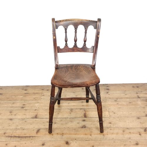 fig 2. A set of three Victorian elm farmhouse dining chairs featuring shaped seats, turned spindles, and dark timber finishes.