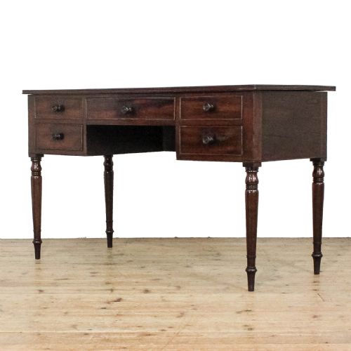 fig 1. An antique dark mahogany writing desk featuring five drawers with turned wooden knobs and slender turned tapering legs.