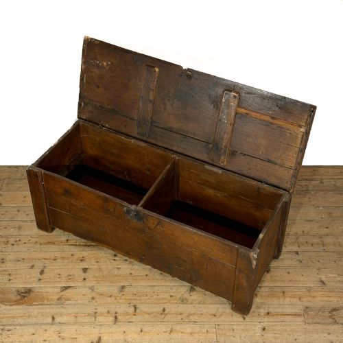 fig 2. A large dark oak coffer featuring the carved initials W A, the date 1647, two small carved crosses, and a central iron lockplate.
