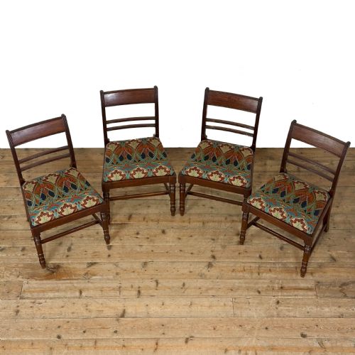 fig 1. Set of four antique mahogany dining chairs with horizontal bar backs, turned front legs, and patterned drop-in upholstered seats.