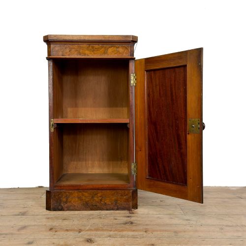 fig 1. A Victorian burr walnut pot cupboard featuring a single panelled door with a turned wooden knob, chamfered corners, and a solid plinth base.