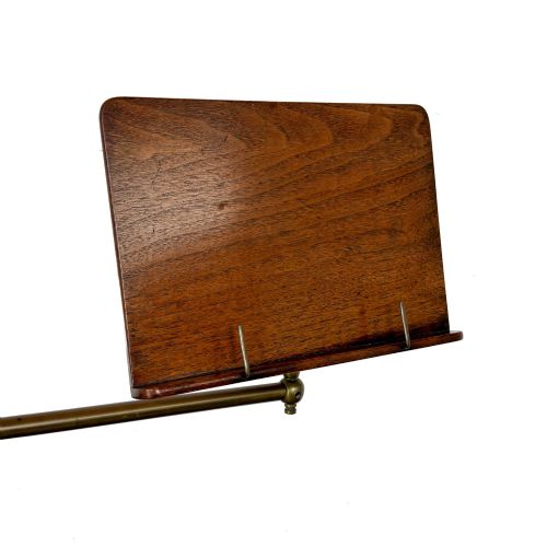 fig 1. A Victorian adjustable reading stand featuring a cast iron decorative base, a brass column with an articulated swing arm, and a rectangular mahogany book rest.