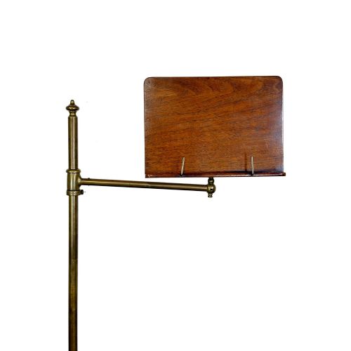 fig 2. A Victorian adjustable reading stand featuring a cast iron decorative base, a brass column with an articulated swing arm, and a rectangular mahogany book rest.