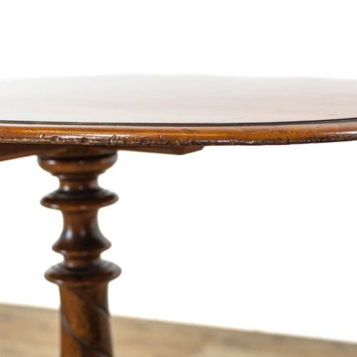 A Victorian mahogany side table featuring a round polished top supported by a spiral-turned pedestal shaft and carved tripod legs. View II