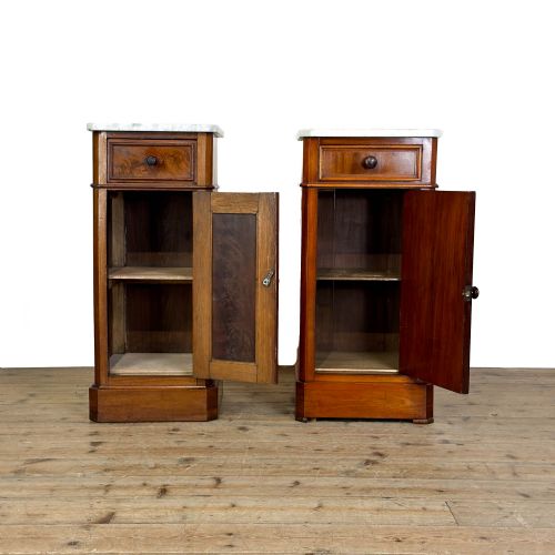 fig 1. A matching pair of French Louis Philippe style walnut bedside cabinets with white marble tops, upper drawers, lower cupboard doors, and plinth bases.