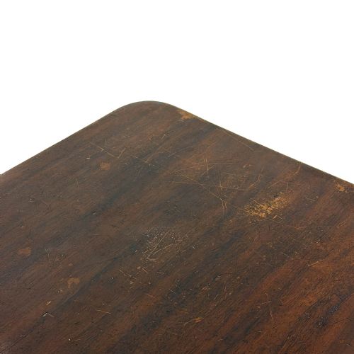 fig 1. A black cast iron Singer treadle sewing machine base fitted with a flat rectangular wooden tabletop.
